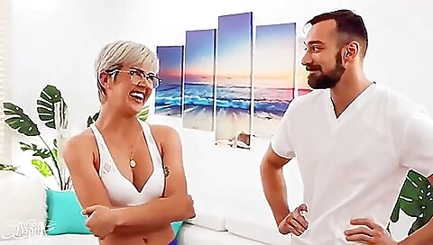 Blonde shemale is fucking with a guy on the massage table